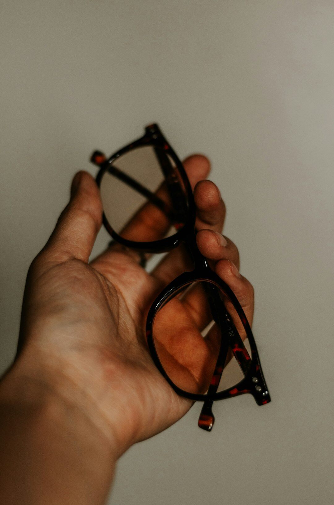 Close up of hand-carved acetate eyewear frame